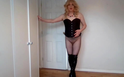 Blonde in black corset and fishnet pantyhose