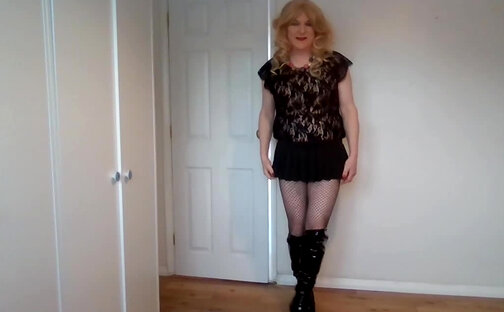 Miniskirt, fishnets and playing with my cock